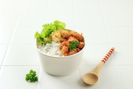 Takeaway Rice Bowl with Chicken Popcorn and Scrambled Eggs, Served in Single Use Packaging White...