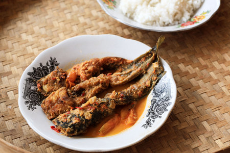 Lele Mangut , Smoked Catfish Cooked in Spicy Coconut Milk Curry Sauce. Typical Food from Mataraman Yogyakarta, Indonesiaの写真素材