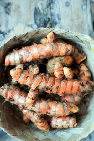 Fresh Turmeric on Bamboo Basket, Close Upの写真素材