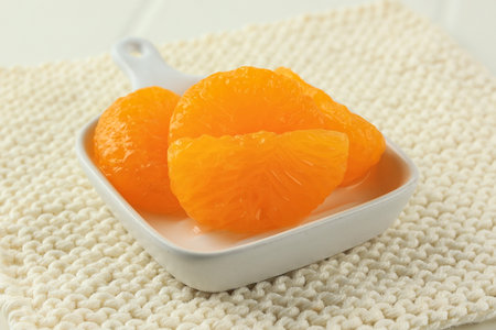 Close Up Preserved Orange on Small White Plateの写真素材