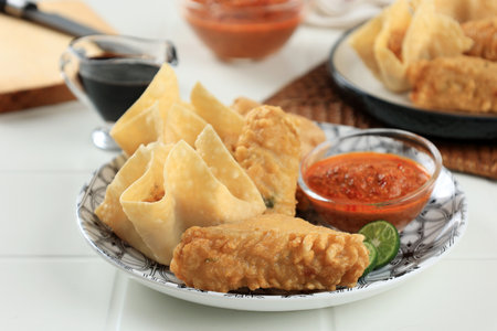 Batagor and Siomay Bandung, Baso Tahu Goreng, Fried Tofu Stuffed with Tapioca Fish Dumpling, Serevd with peanut Sauce, Sweet Soy Sauce, and Limeの写真素材