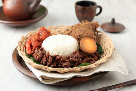 Nasi Gudeg Komplit,  Typical Food from Yogyakarta, Indonesia. Rice with Jackfruit Stew Cooked with Coconut Milk.の写真素材