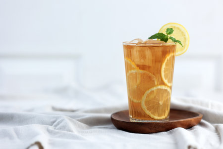 Fresh Homemade Es Lemon Teh or Iced Lemon Tea on Tall Glass on White Background. Copy Space for Textの写真素材