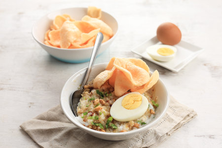 Bubur Ayam Diaduk, Indonesian Rice Chicken Porridge for Breakfast, Served with Stir and Mix all Ingredientsの写真素材