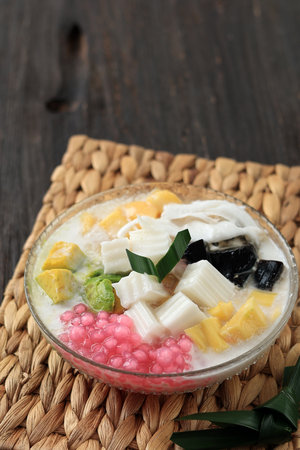 Es Goyobod is Rice Pudding with Avocado, Fermented Cassava, Tapioca Pearl, and Jackfruit, Served with Sweet Coconut Milk Syrup and Ice Cubeの写真素材