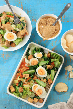 Top View Gado-Gado, Boiled Vegetables, Potato, Tempeh, Tofu, Boiled Eggs Seasoned with Peanut Sauce Dressing. Popular from Jakarta, Indonesiaの写真素材