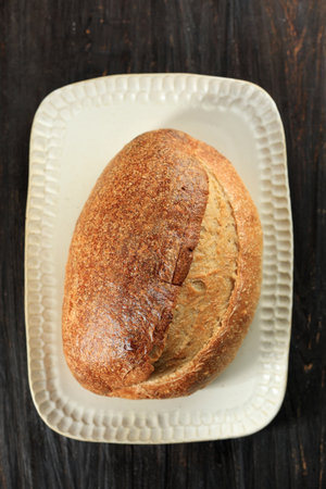 Fresh Homemade Sourdough Country Bread on White Ceramic Plate