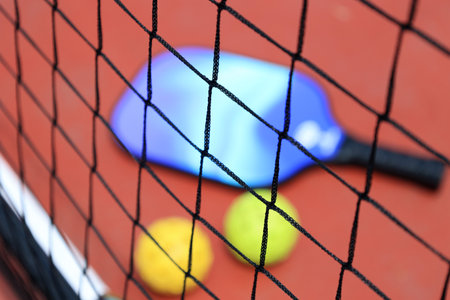 Blurry Pickle Ball Net with Ball and Paddleの写真素材