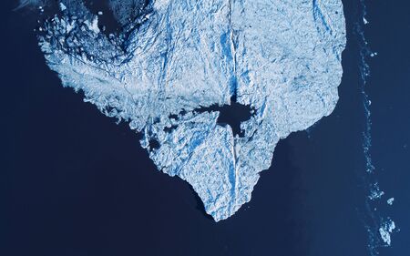 Melting ice cap from above, drone photography perspective