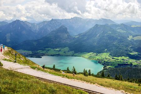 AUGUST 4, 2019 - SANKT WOLFGANG IN SALZKAMMERGUT, AUSTRIA: Panoramic view from Schafberg mountain to Wolfgangsee, Austrian Alps, next to Sankt Wolfgang im Salzkammergutのeditorial素材