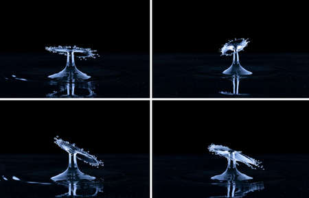 Splash and umbrella on black background. Reflection on the surface of the water.の写真素材