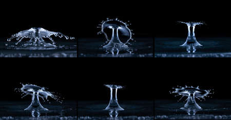 Splash and umbrella on black background. Reflection on the surface of the water.の写真素材