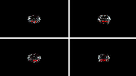 Splash and crown on black background. Reflection on the surface of the water.の写真素材