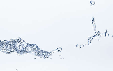 Water splash on a white background. Reflection on the surface of the water.