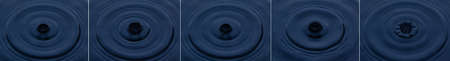 Splash and crown on blue background. Reflection on the surface of the water.の写真素材
