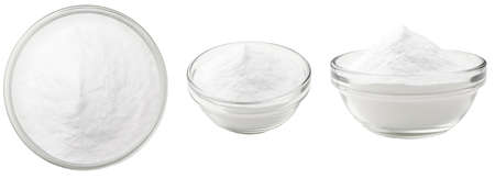 Soda in a glass bowl. Soda, flour, salt or sugar in a glass container. Three different angles of a plate with soda, flour, salt or sugar on a white background.の写真素材