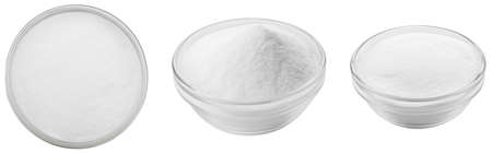 Soda in a glass bowl. Soda, flour, salt or sugar in a glass container. Three different angles of a plate with soda, flour, salt or sugar on a white background.の写真素材