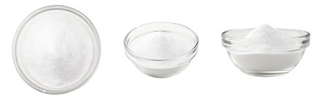 Soda in a glass bowl. Soda, flour, salt or sugar in a glass container. Three different angles of a plate with soda, flour, salt or sugar on a white background.の写真素材