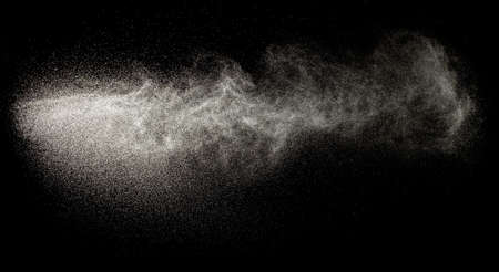 Sprayed water. Splashes and drops of water isolated on black background.の写真素材