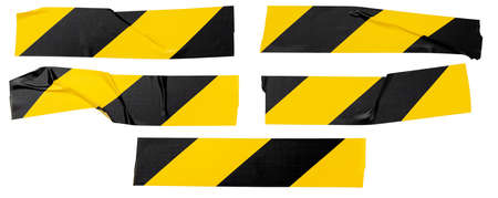 Yellow-black sticky tape, torn horizontal and sticky pieces of different sizes, isolated on white...