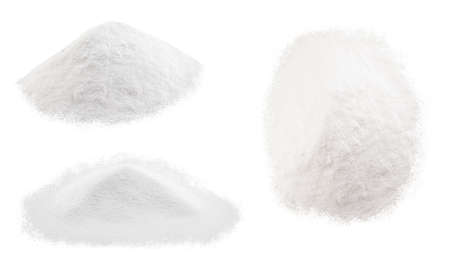 Soda, flour, salt or sugar are poured in heaps. Three different heaps of white powder isolated on a white background.の写真素材