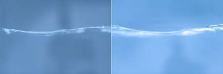 Glossy water surface. Side view of water waves on a blue background.