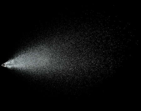 Sprayed water. Splashes and drops of water isolated on black background.の写真素材