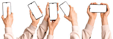 A man holds in his hands a blank black smartphone screen with a modern frameless design. Five positions isolated on white backgroundの写真素材