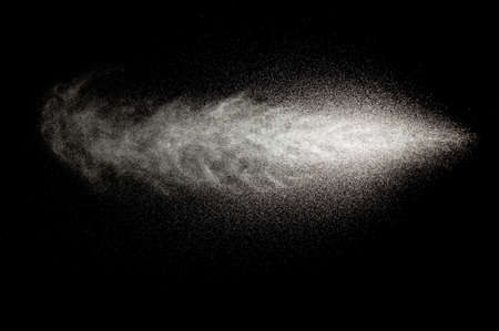 Sprayed water. Splashes and drops of water isolated on black background.の写真素材