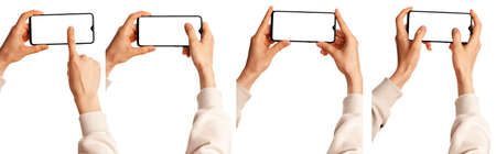 A man holds in his hands a blank black smartphone screen with a modern frameless design. Four positions isolated on white backgroundの写真素材