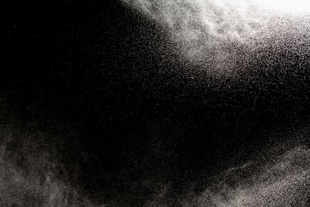 Sprayed water. Small droplets of water in the air. Lots of water drops, isolated on black background.の写真素材