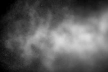 Sprayed water. Small droplets of water in the air. Lots of water drops, isolated on black background.の写真素材