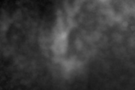 Sprayed water. Small droplets of water in the air. Lots of water drops, isolated on black background.の写真素材