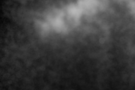 Sprayed water. Small droplets of water in the air. Lots of water drops, isolated on black background.の写真素材