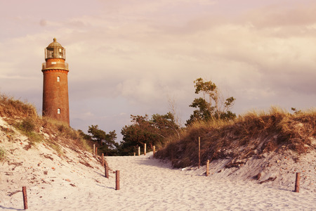 Old lighthouse in the dunesの写真素材