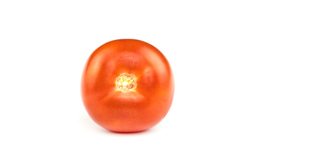 Fresh red tomato isolated on a white background without a stemの写真素材