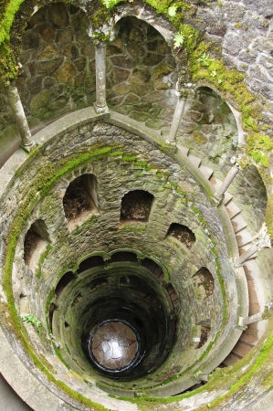 Inverted Tower - Initiatory well  Poco Iniciatico , in Quinta da Regaleira, Sintra, Portugal  The Palace and its sorrounding gardens are part of the Cultural Landscape of Sintra, declared World Heritage by the UNESCO in 1995 のeditorial素材