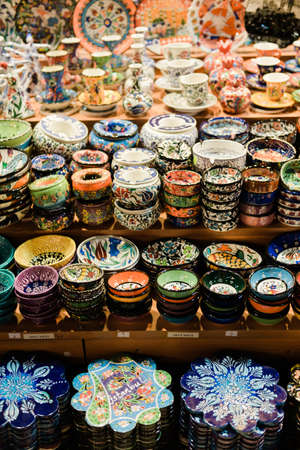 Vertical photo of handicraft pottery items at a market stallの写真素材
