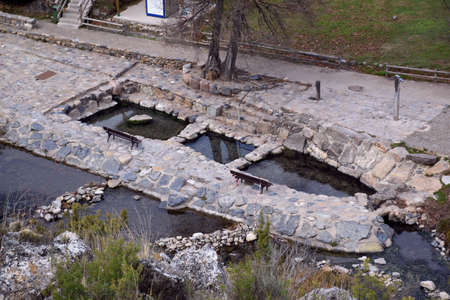 View of the hot springs in the village of Arnedillo. View from the mountain, cloudy day. Thermal water pools in the village of Arnedillo.の写真素材