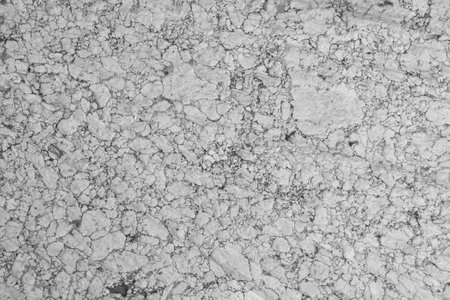 Background of old weathered flour mill granite stone. Colors of white, gray and black granite, stone over a hundred years old.の写真素材