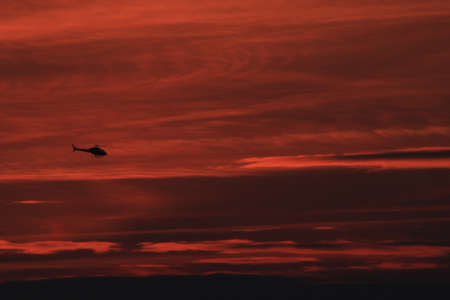 helicopter on red backgroundの写真素材