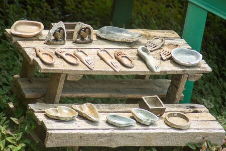 Stone and wooden item on dosplay on a table in Swazoland. The items include replica of materials used by the ancestors long time back.の写真素材