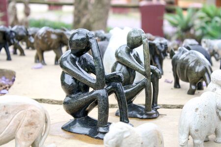 Soft stone made replica of two wise men thinking. In rural africa, wise men are respected and they are a popular subject for art.の写真素材