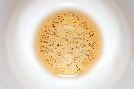 Remains of tea at the bottom of a cup of teaの写真素材