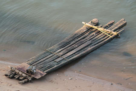 Lonely Kattumaram the fishing Boat using Tamil nadu North Chennai at river shoreの写真素材