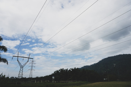 View transmission towers (power tower, electricity pylon, steel lattice tower) cloud blue sky....
