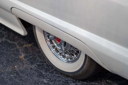 Detail of the front wheel of an old American car.の写真素材
