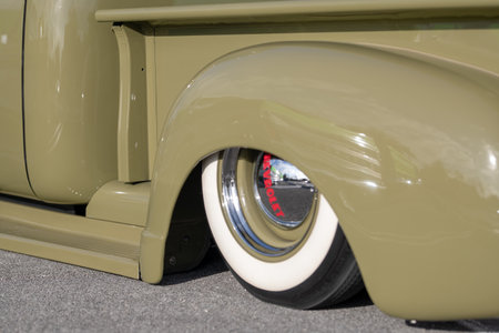 Close-up of the wheel of a classic American pickup truck.の写真素材