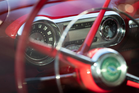 Steering wheel and dashboard of a vintage car, close-up