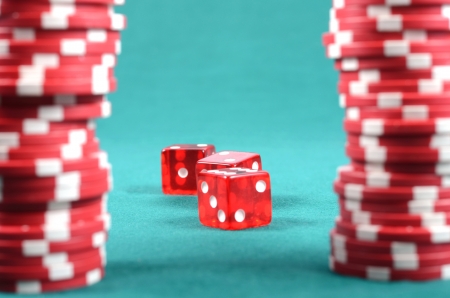 poker gambling chips on a green playing table, stacks of poker chips , casino concept